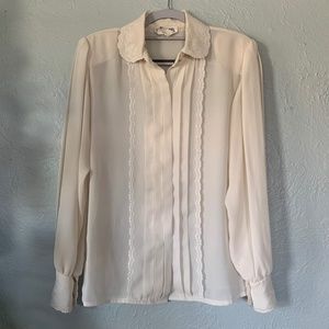 white frilly button up shirt